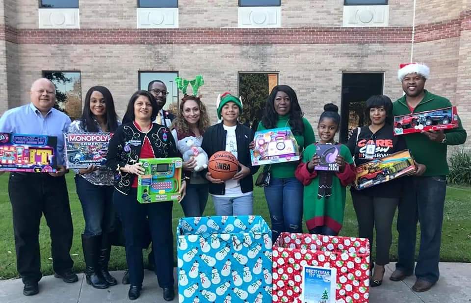 Volunteers gathered with donated toys at a holiday toy drive